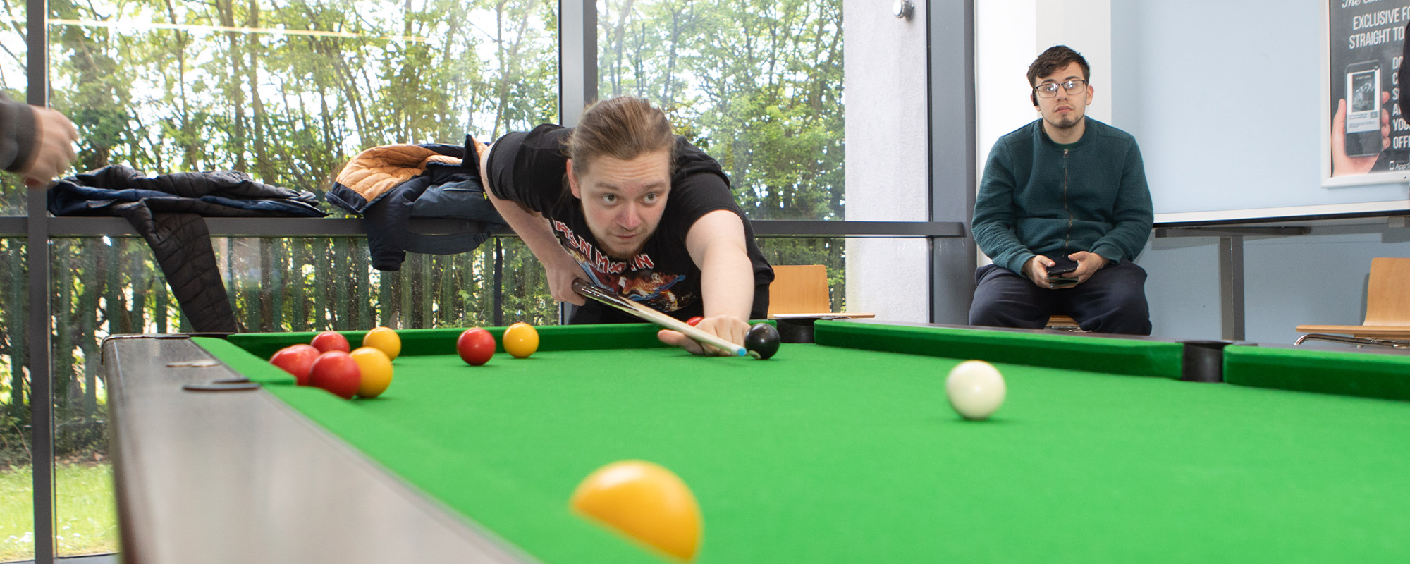 Students playing pool in the refectory