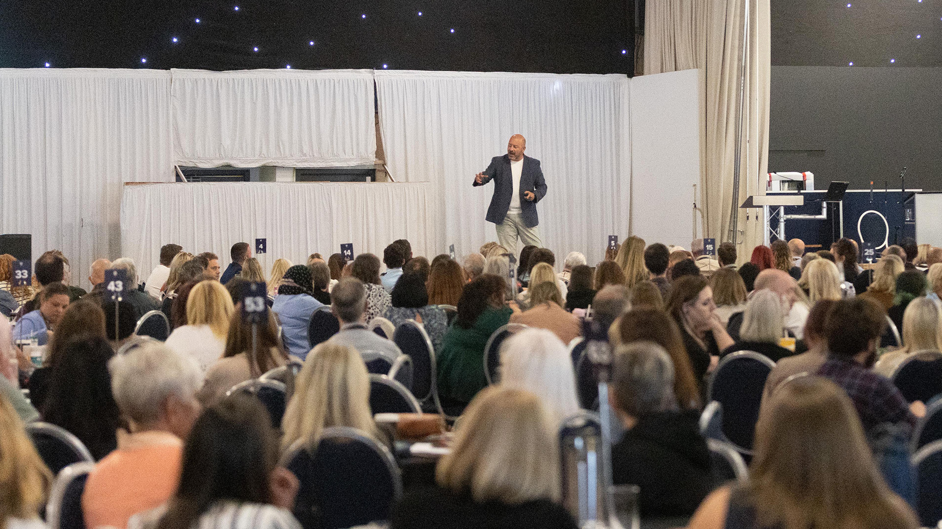 Staff listening to the key note speaker at the annual conference