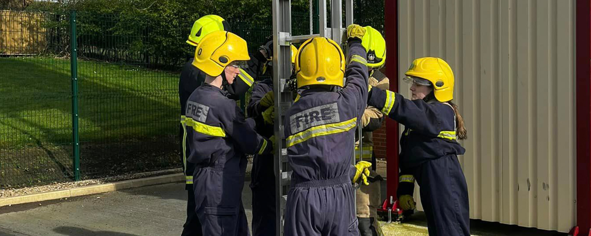 Students at a work placement with the fire service