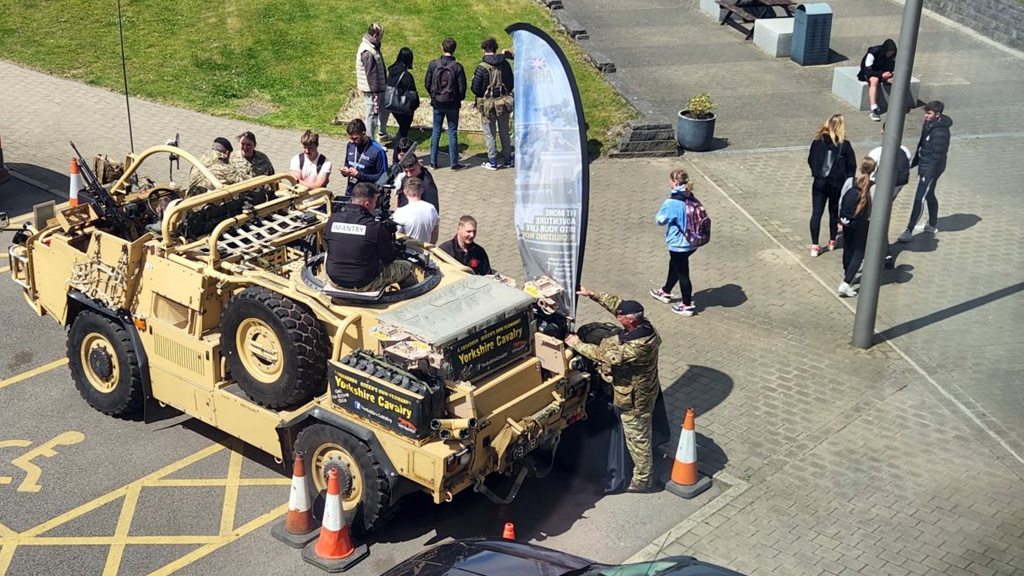 Students with a Yorkshire Cavalry army jeep