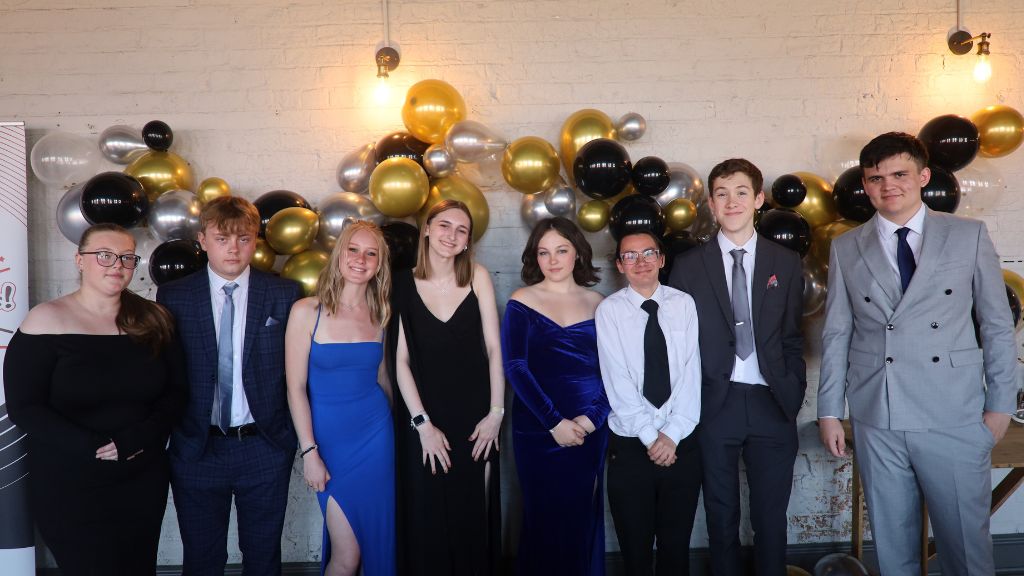 Students infront of balloon arch at Sixth Form Awards 