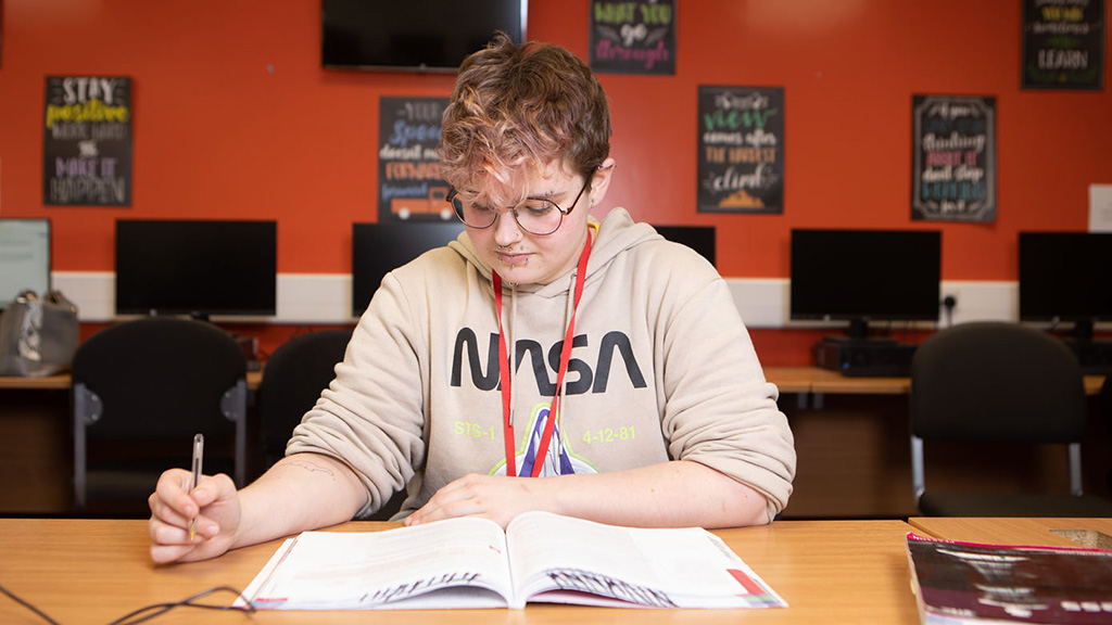 Student working in book