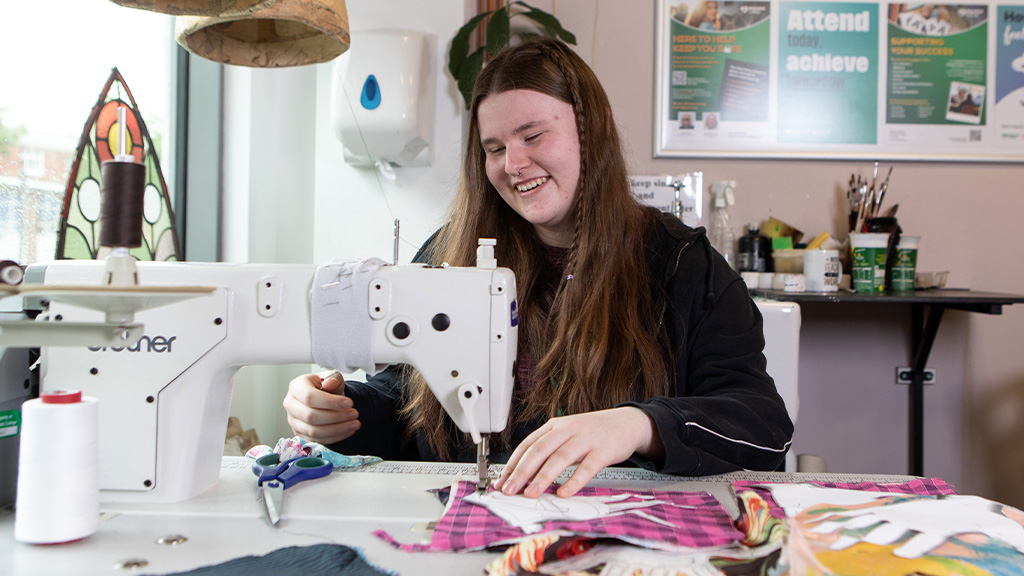 Student working on a sewing machine