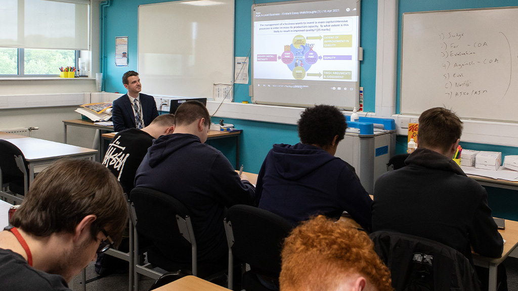 Class of students listening to a tutor