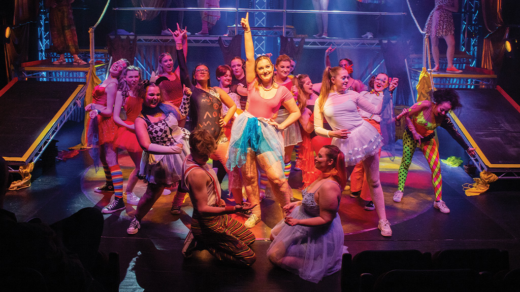 A group of students performing on stage