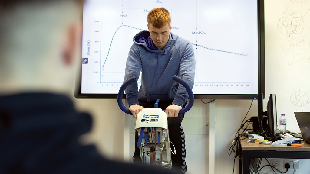 Student on exercise bike